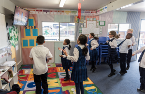 Primary school classroom dancing and enjoying EC2D dance tutorial.