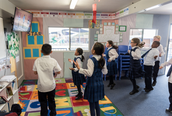 Primary school classroom dancing and enjoying EC2D dance tutorial.